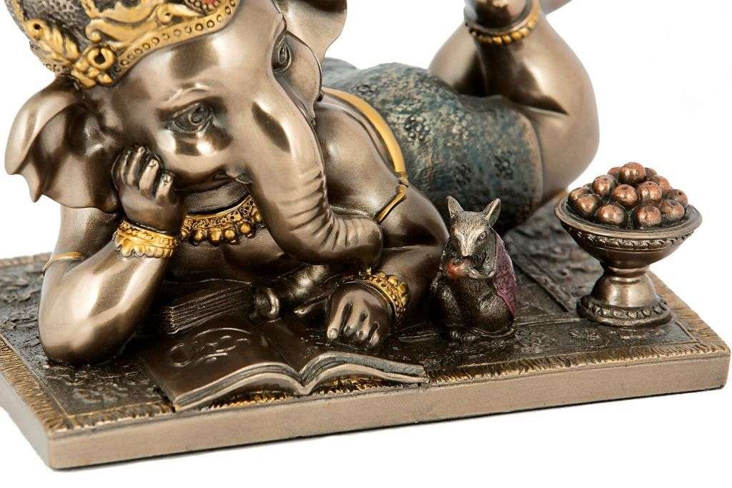 Cute Ganesha Lying Pose Reading Book for Home Decoration-Length-5 Inches-Antique Finish-Resin